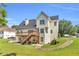 Spacious backyard with a large deck and patio area, perfect for outdoor entertaining at 1945 Kevin Se Dr, Conyers, GA 30013