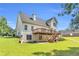 Large backyard with a deck and patio area, ideal for relaxing or grilling at 1945 Kevin Se Dr, Conyers, GA 30013
