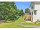 Lush backyard with a patio and a deck, offering a serene outdoor space at 1945 Kevin Se Dr, Conyers, GA 30013