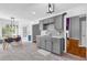 The kitchen area featuring gray cabinetry, a stainless steel faucet, and space for dining at 1945 Kevin Se Dr, Conyers, GA 30013