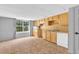 Basement kitchenette area features wooden cabinets, a sink, and a dishwasher for convenience at 1945 Kevin Se Dr, Conyers, GA 30013
