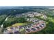 Beautiful aerial view of the community surrounded by lush green trees at 2455 Bleckley Pl, Cumming, GA 30041