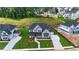 Aerial view of a neighborhood featuring manicured lawns and newly constructed homes at 2455 Bleckley Pl, Cumming, GA 30041