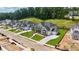 Aerial view of a neighborhood featuring manicured lawns and newly constructed homes at 2455 Bleckley Pl, Cumming, GA 30041