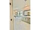 Bright bathroom with double vanity, tub, and marble tile at 2455 Bleckley Pl, Cumming, GA 30041