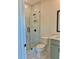 Updated bathroom features a glass shower, toilet, and vanity with modern finishes at 2455 Bleckley Pl, Cumming, GA 30041