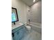 Stylish bathroom featuring marble tile, a bathtub, a shower and modern vanity at 2455 Bleckley Pl, Cumming, GA 30041