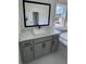 Modern bathroom with marble tile, glass shower, and a sleek vanity with black hardware at 2455 Bleckley Pl, Cumming, GA 30041