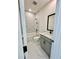 Modern bathroom with marble floors, tiled shower, and stylish vanity at 2455 Bleckley Pl, Cumming, GA 30041