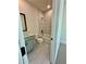 Modern bathroom featuring a tub with marble tile surround and modern fixtures at 2455 Bleckley Pl, Cumming, GA 30041