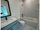 Stylish bathroom featuring marble tile, a bathtub, a shower and modern vanity at 2455 Bleckley Pl, Cumming, GA 30041