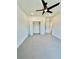 Spacious bedroom featuring carpeted floors, ceiling fan, and closet at 2455 Bleckley Pl, Cumming, GA 30041