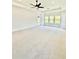 Large bedroom with plush carpet, a ceiling fan, and natural light from many windows at 2455 Bleckley Pl, Cumming, GA 30041