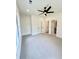 Large bedroom with carpeted floors, ceiling fan, closet, and a bathroom at 2455 Bleckley Pl, Cumming, GA 30041