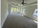 Spacious bedroom filled with natural light, featuring a trey ceiling and a ceiling fan at 2455 Bleckley Pl, Cumming, GA 30041