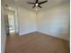 Bright bedroom with hardwood floors and ceiling fan at 2455 Bleckley Pl, Cumming, GA 30041