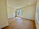 Bright bedroom with hardwood floors and recessed lighting is bathed in natural light at 2455 Bleckley Pl, Cumming, GA 30041