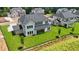 Aerial view of new construction home with a dark roof and a large backyard at 2455 Bleckley Pl, Cumming, GA 30041