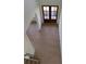 Welcoming foyer showcasing hardwood floors, a wooden front door with glass panes and staircase at 2455 Bleckley Pl, Cumming, GA 30041