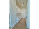 Bright hallway featuring white cabinets, drawers, and a light wood floor at 2455 Bleckley Pl, Cumming, GA 30041