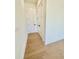 Hallway with hardwood floors and white trim at 2455 Bleckley Pl, Cumming, GA 30041