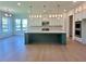Bright, spacious kitchen with a large center island, modern cabinets, and hardwood floors at 2455 Bleckley Pl, Cumming, GA 30041