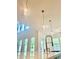 Modern kitchen with pendant lights, white countertops, and stainless steel faucet at 2455 Bleckley Pl, Cumming, GA 30041