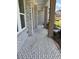 Inviting porch with brick flooring and pillars, offering a glimpse of the home's exterior at 2455 Bleckley Pl, Cumming, GA 30041
