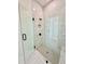 Glass enclosed shower showcasing sleek tile design and matte black fixtures at 2455 Bleckley Pl, Cumming, GA 30041