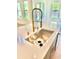 Close-up of the stainless steel sink and stylish gold faucet fixture at 2455 Bleckley Pl, Cumming, GA 30041