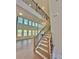 Elegant staircase with wrought iron railing leads to the upper level at 2455 Bleckley Pl, Cumming, GA 30041