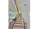 Grand staircase with wood treads and black metal railing at 2455 Bleckley Pl, Cumming, GA 30041