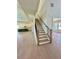 Elegant staircase with wooden handrail and black iron balusters at 2455 Bleckley Pl, Cumming, GA 30041