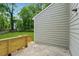 Back exterior view featuring neutral siding and a wooden porch perfect for outdoor seating at 2780 Northwood Court Sw Ct, Marietta, GA 30060