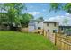 A level and expansive backyard with a new wooden deck and fenced perimeter at 2780 Northwood Court Sw Ct, Marietta, GA 30060