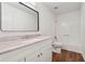 Updated bathroom with modern vanity, a framed mirror, and a shower-tub combo at 2780 Northwood Court Sw Ct, Marietta, GA 30060