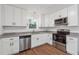 Modern kitchen featuring white cabinets, stainless steel appliances and granite countertops at 2780 Northwood Court Sw Ct, Marietta, GA 30060