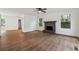 Spacious living room with hardwood floors, a classic fireplace, and bright windows at 2780 Northwood Court Sw Ct, Marietta, GA 30060