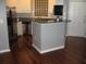 Well-lit kitchen with stainless steel appliances, granite countertops, and hardwood flooring at 10 Perimeter Summit Ne Blvd # 3105, Atlanta, GA 30319