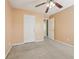 The bedroom features neutral colors, a ceiling fan, and access to the rest of the house at 1056 Shadow Lake Dr, Lithonia, GA 30058