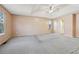 An expansive primary bedroom features two large windows and an ensuite bathroom at 1056 Shadow Lake Dr, Lithonia, GA 30058