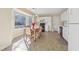 Cozy eat-in kitchen area with bay window and white cabinets at 1056 Shadow Lake Dr, Lithonia, GA 30058
