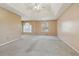 Spacious main bedroom with ceiling fan and multiple windows at 1056 Shadow Lake Dr, Lithonia, GA 30058