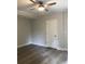 Clean bedroom with a ceiling fan, one closet and neutral walls at 1547 Grove Arbor Ter, Dacula, GA 30019