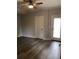 Neutral bedroom with ceiling fan, two closets and door leading to the outside at 1547 Grove Arbor Ter, Dacula, GA 30019