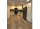 Modern kitchen featuring stainless steel appliances, gray backsplash and white cabinets at 1547 Grove Arbor Ter, Dacula, GA 30019