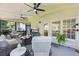 Relaxing screened porch with comfortable seating and a view of the backyard at 1547 Grove Arbor Ter, Dacula, GA 30019