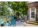 Cozy back patio with seating, plants and exterior entrance at 1547 Grove Arbor Ter, Dacula, GA 30519
