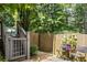 Fenced yard with gate, chairs and table at 1547 Grove Arbor Ter, Dacula, GA 30519
