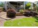 Backyard with landscaped flowerbeds and retaining wall at 1547 Grove Arbor Ter, Dacula, GA 30519